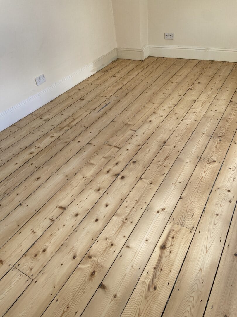 C2. Pine wood floor sanding before on painted floor art of clean cambridge GMB