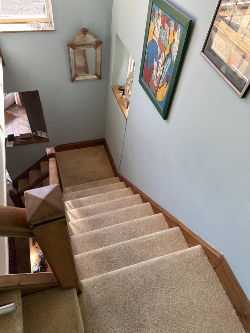 Clean stair carpet after professional cat hair removal in Haverhill, viewed looking down the staircase
